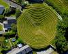 Aerial view of circular grassed pit with descending levels