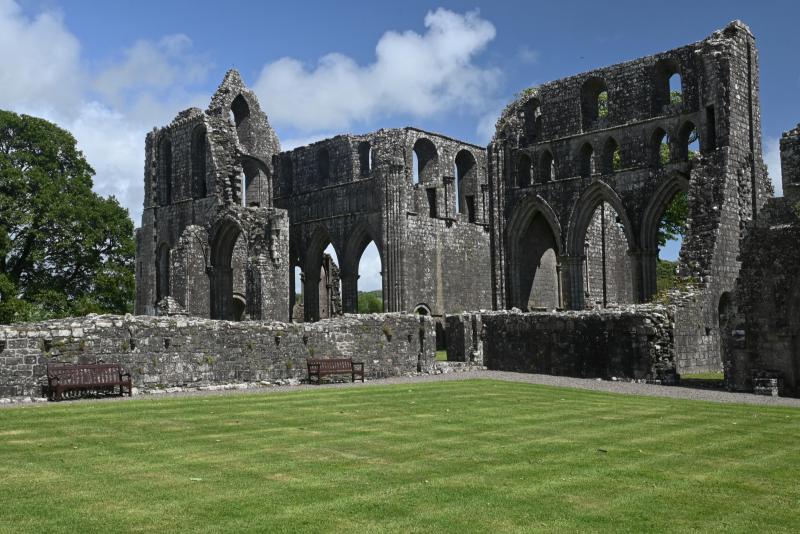 A view of the main ruins of Dundrennan Abbey on a sunny day